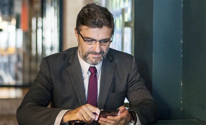 Operator reviewing bookings on his phone